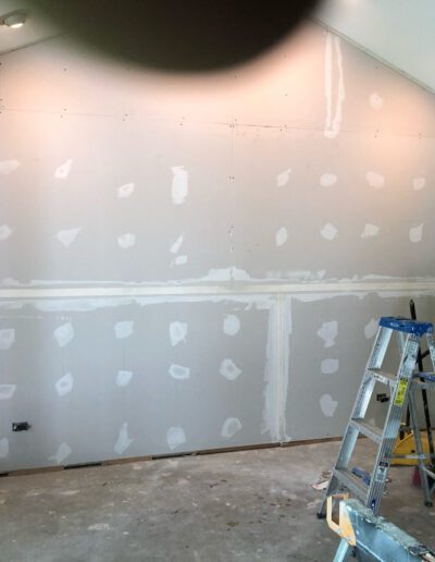 A room that is being remodeled with drywall.