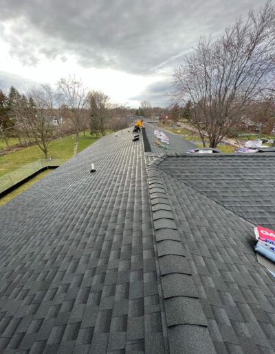 A roof with a black shingle on it.