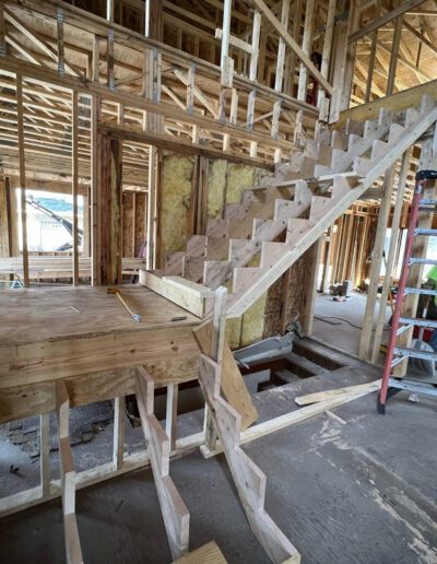 A staircase is being built in a house that is under construction.